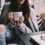 Girl drinking wine in her mug